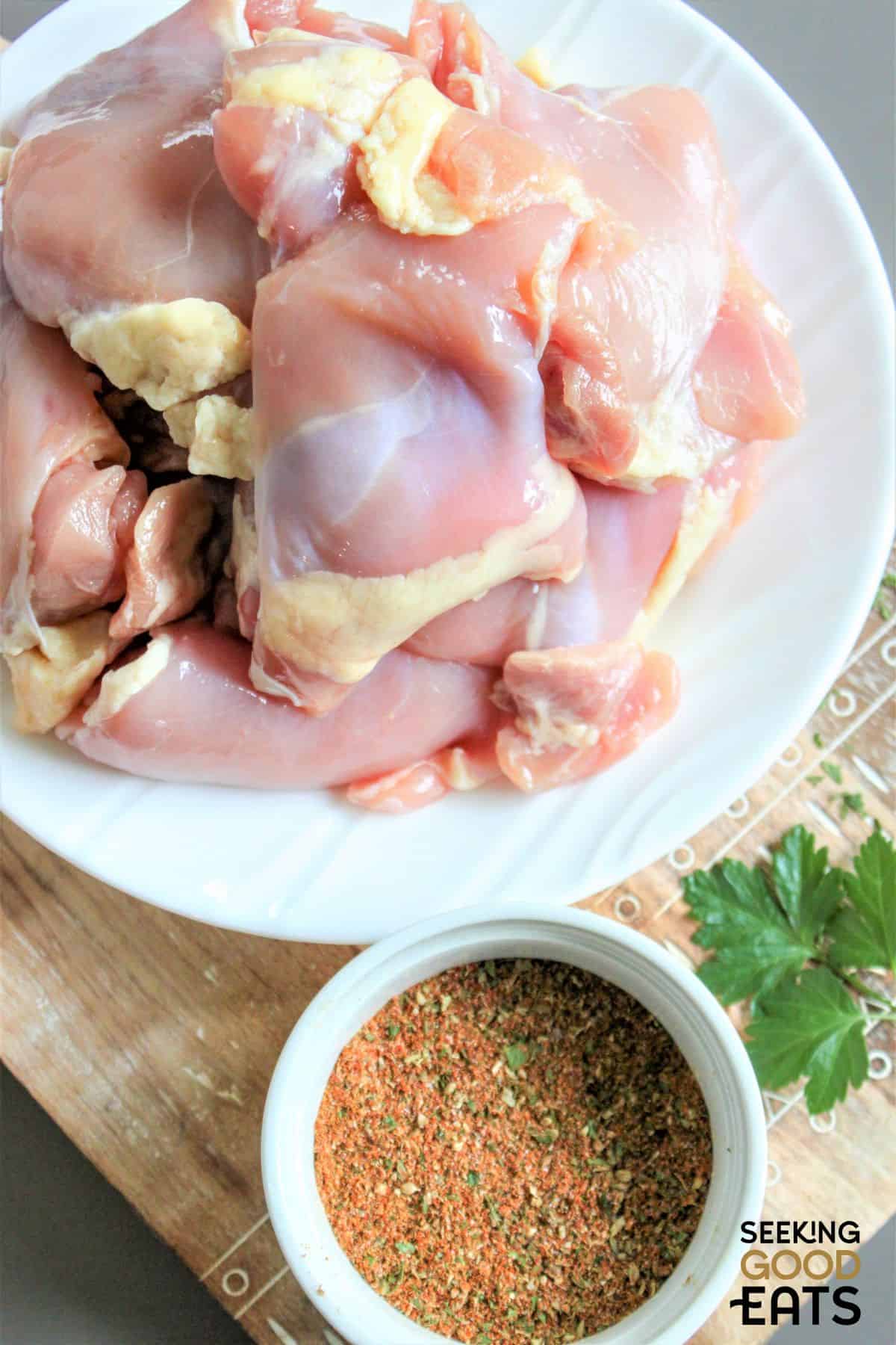 An image of the ingredients need for boneless chicken thighs with dry rub.