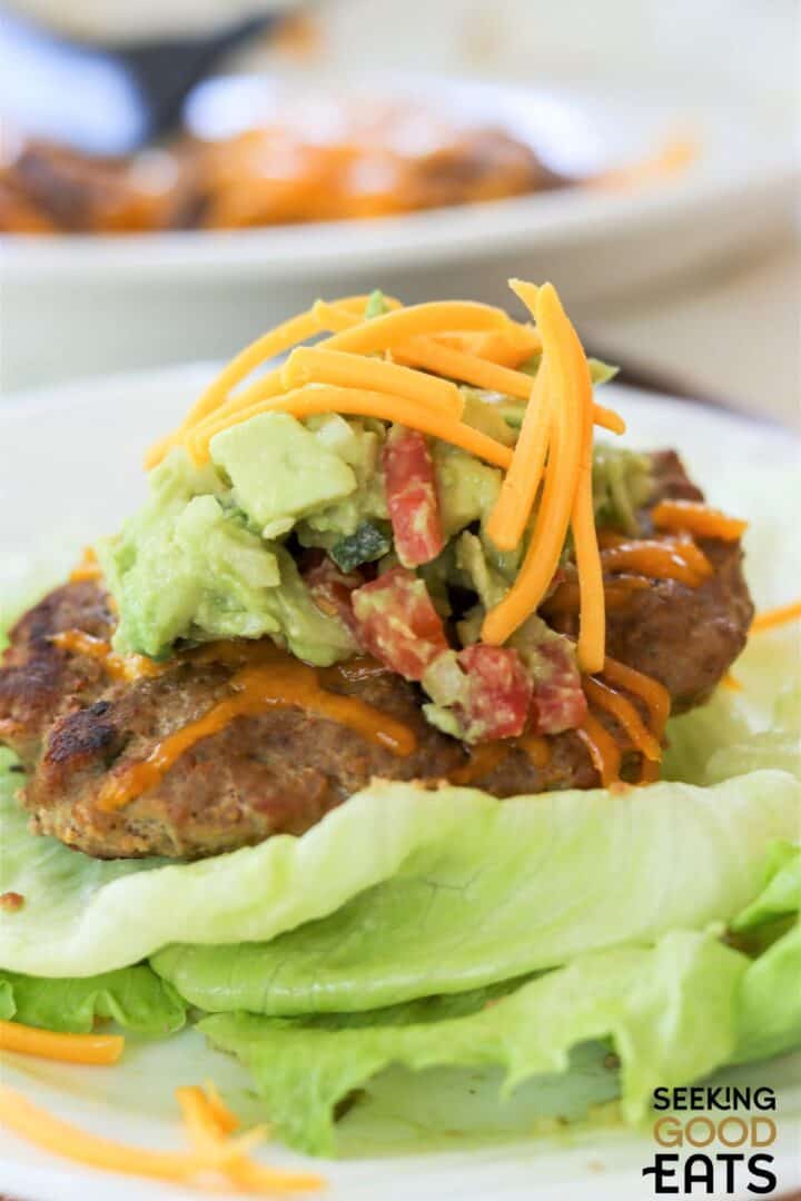 Southwest grilled turkey burgers with cheese on top.