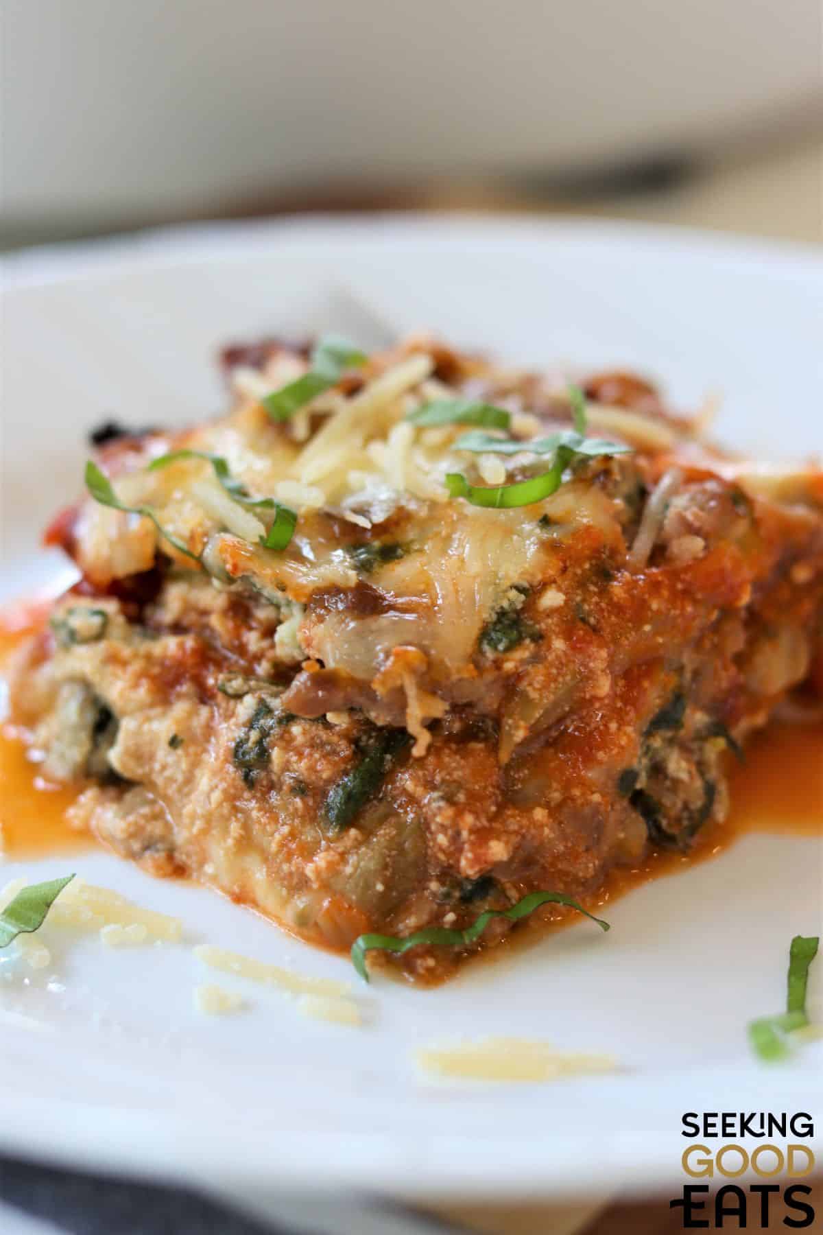 Slice of low carb eggplant lasagna served on a plate.