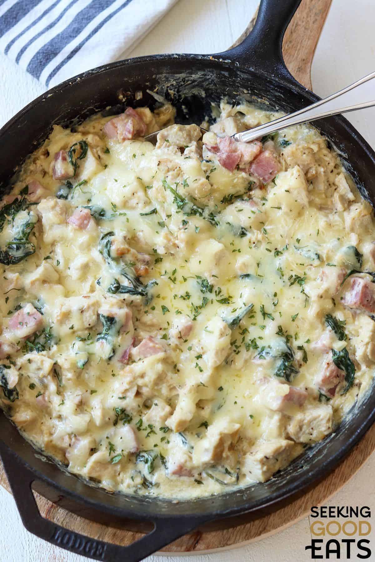 Chicken cordon bleu casserole with spoon.
