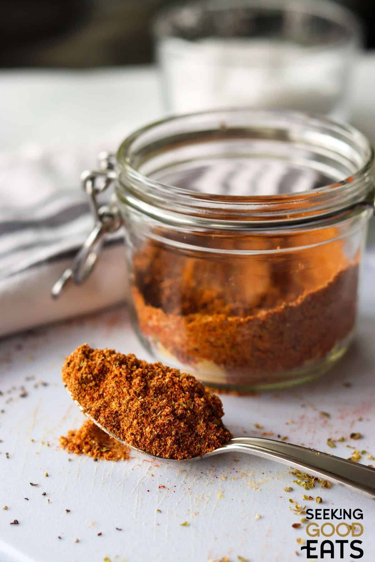 A clear jar of homemade fajita seasoning. 