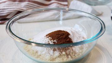 Mixing dry ingredients in a clear glass bowl