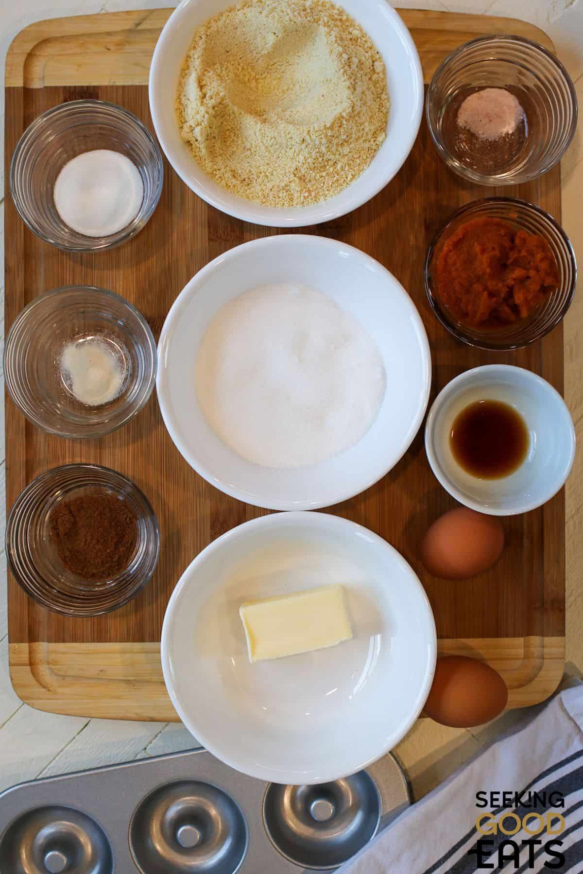 Image of ingredients needed for baked spiced pumpkin donuts.