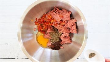 mixing turkey burger ingredients in a bowl