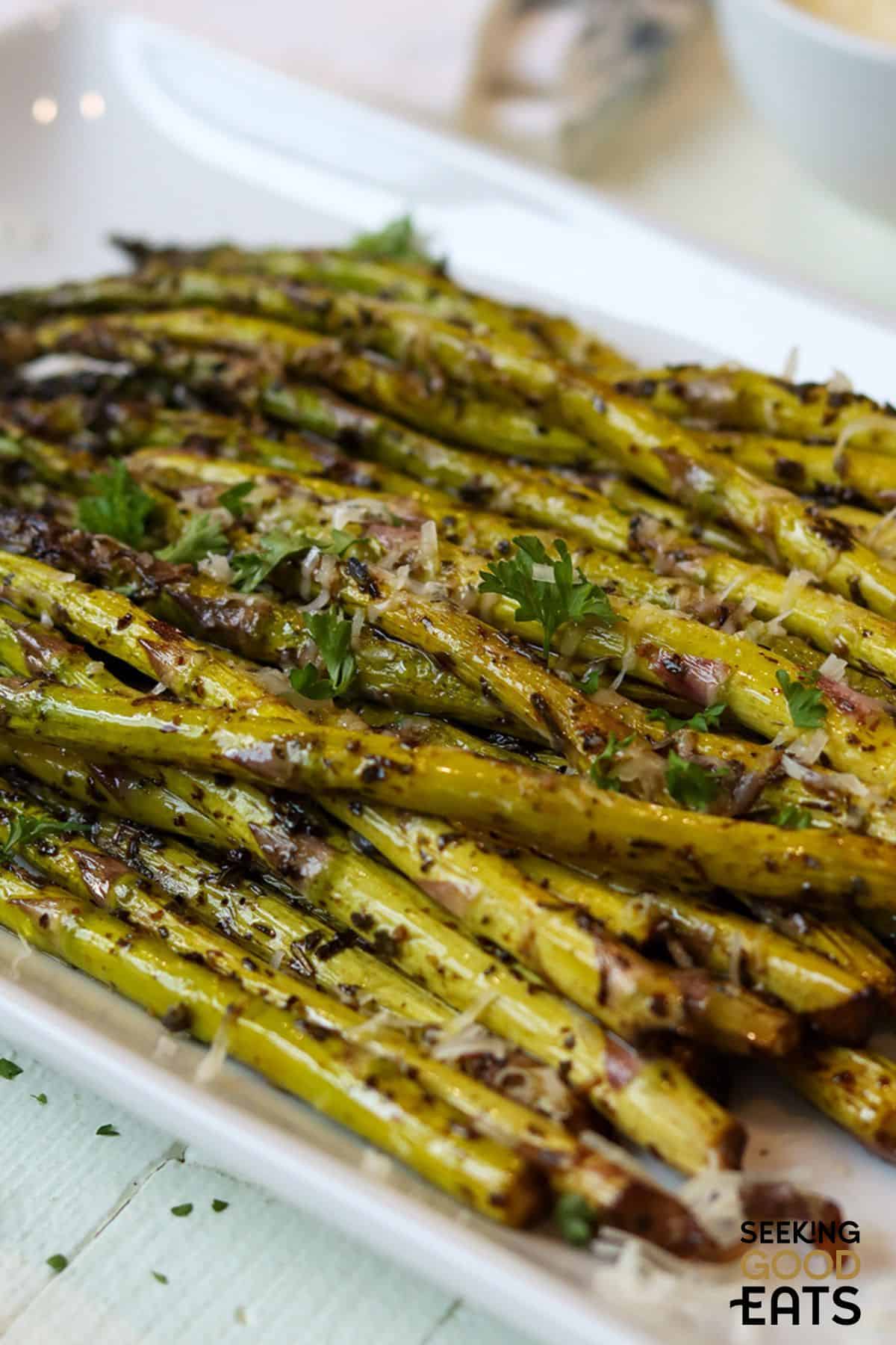 Cooked asparagus with balsamic vinegar and parmesan cheese.