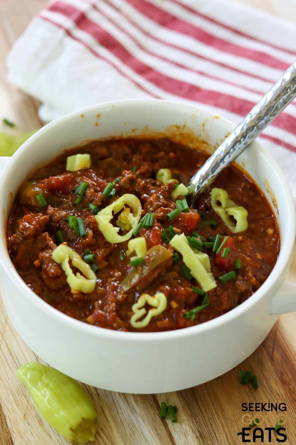 A bowl of this no bean chili slow cooker being served with a spoon.