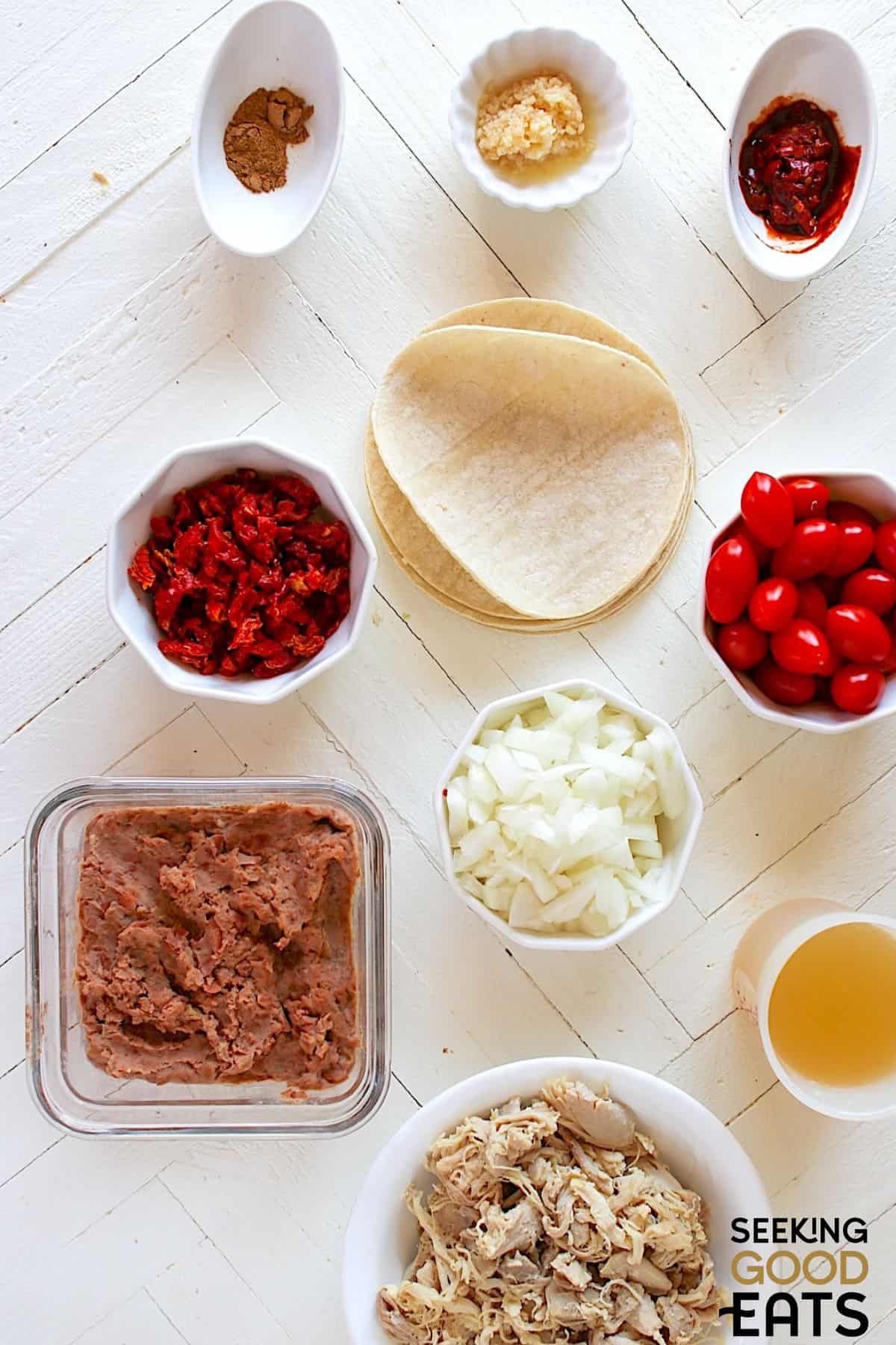 Ingredients needed to make chicken tostadas de tinga.