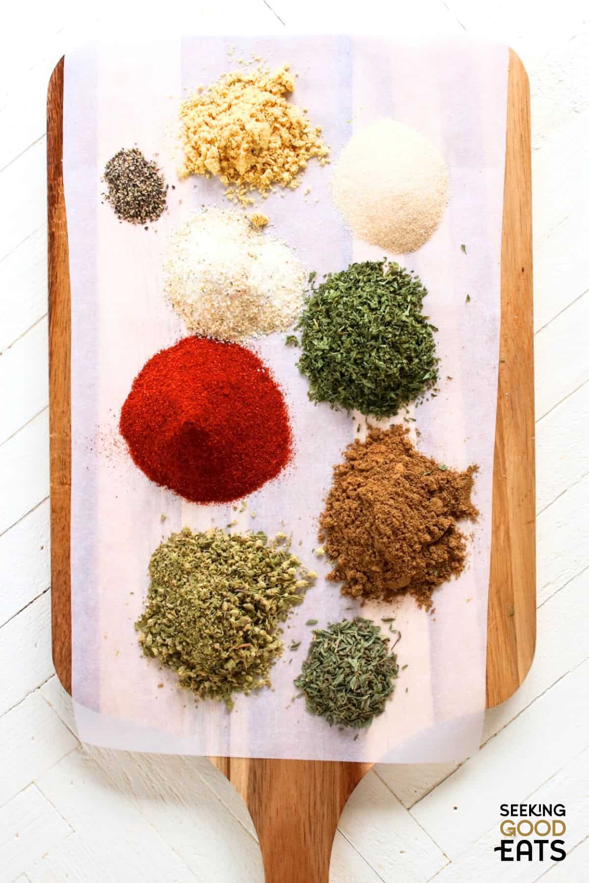 dry rub for pork ingredients spread out on a cooking board