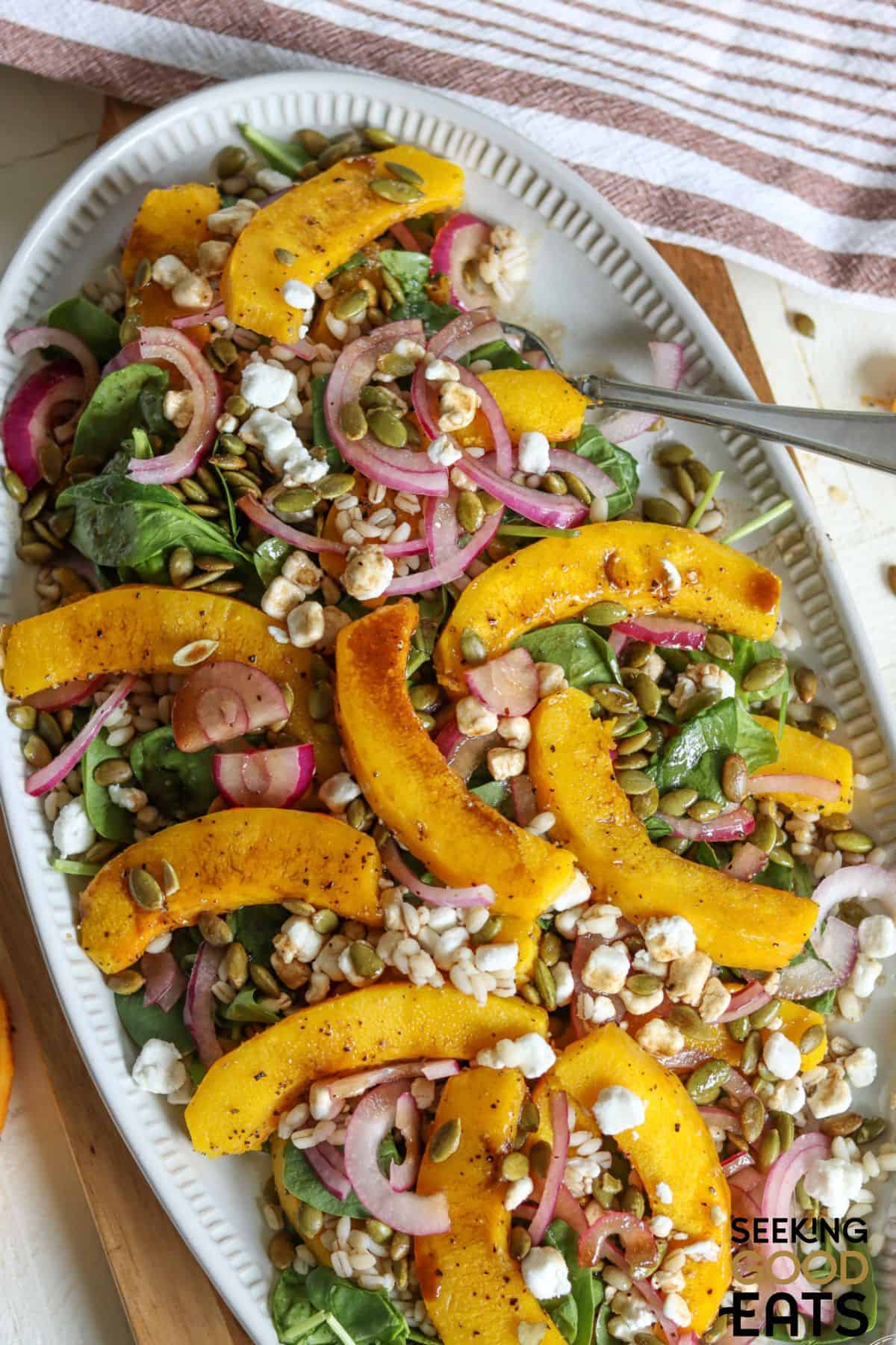 Easy Roasted pumpkin salad on a white plate.