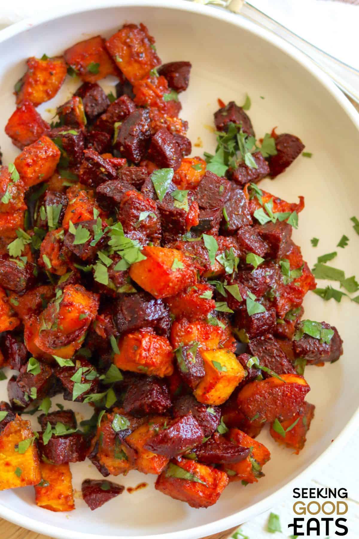 A plate of easy beetroot salad and roasted pumpkin ready to serve.