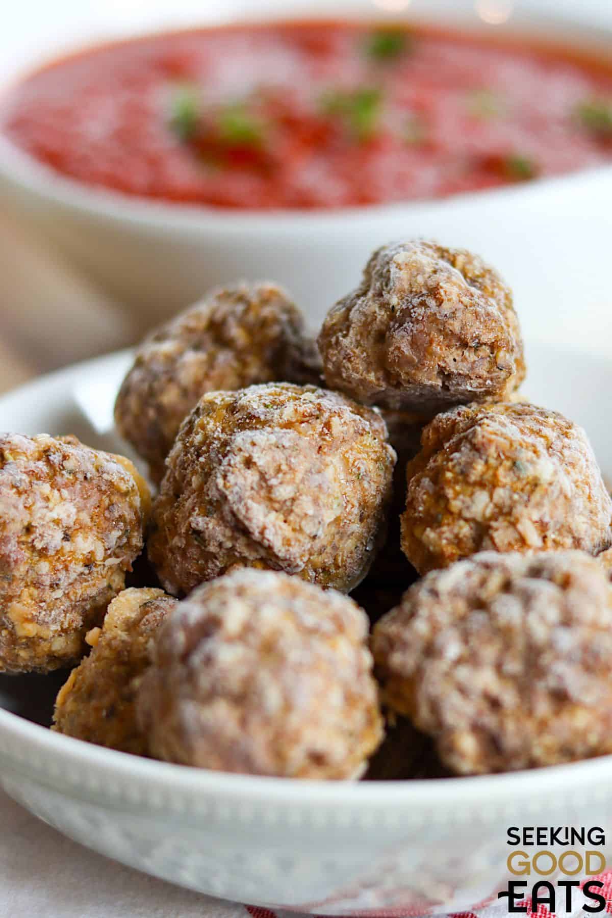 A bowl of homemade frozen meatballs.