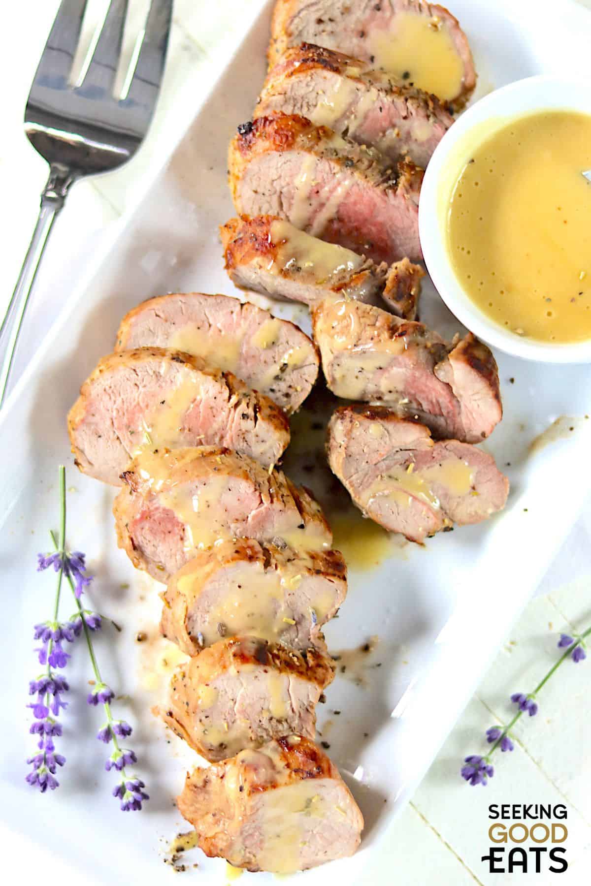 Tender pork tenderloin served with Dijon mustard sauce.