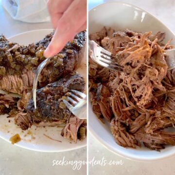 Shredding the cooked barbacoa beef and placing in a white oval serving dish.