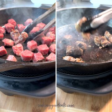 Searing steak bites in a cast iron skillet.