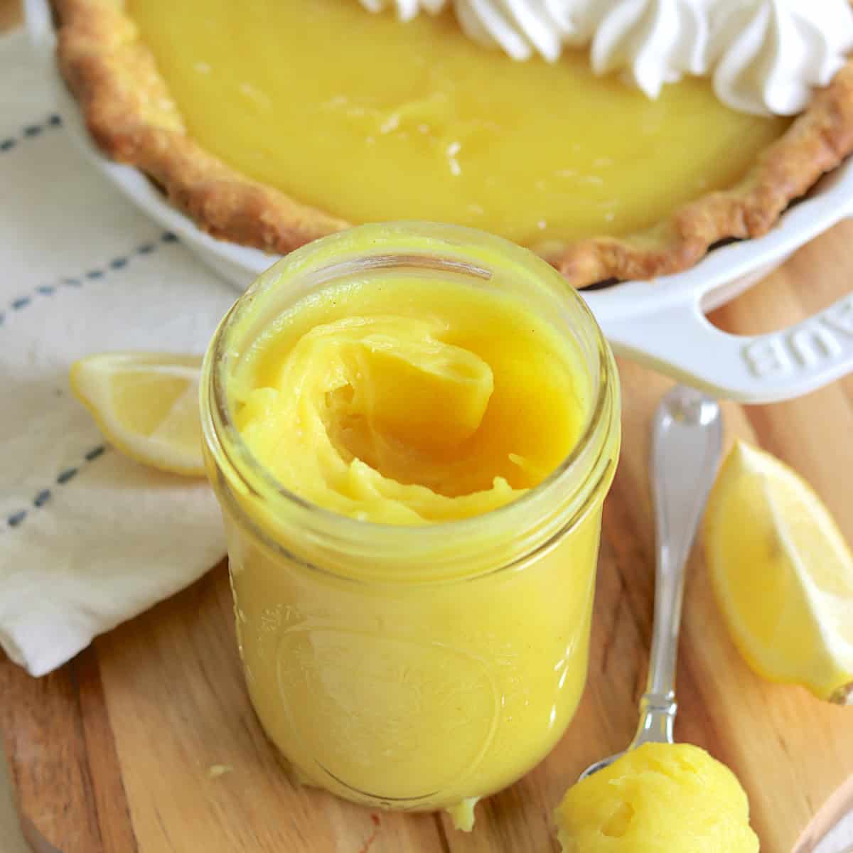 A clear jar of vegan lemon curd.