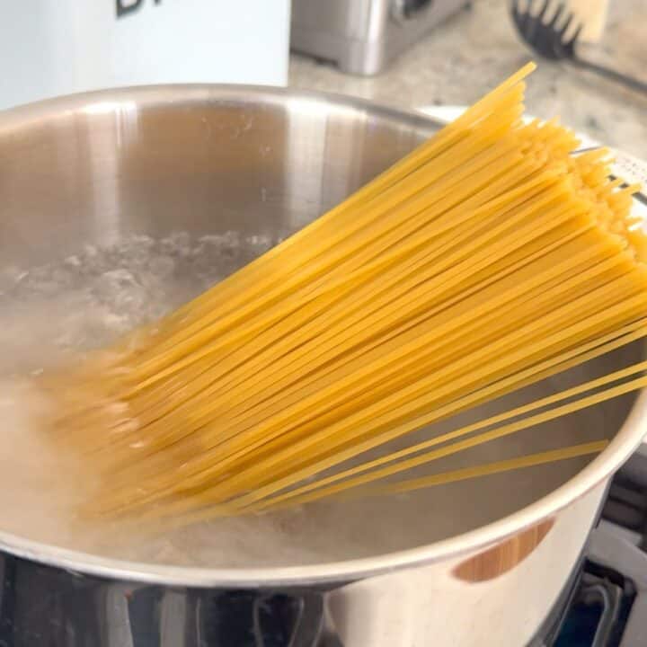 Cooking pasta in a large saucepot.