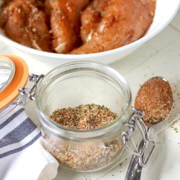 Montreal chicken seasoning blend in a clear glass jar.
