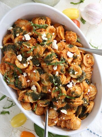 cherry tomato pasta in an oval white serving dish.