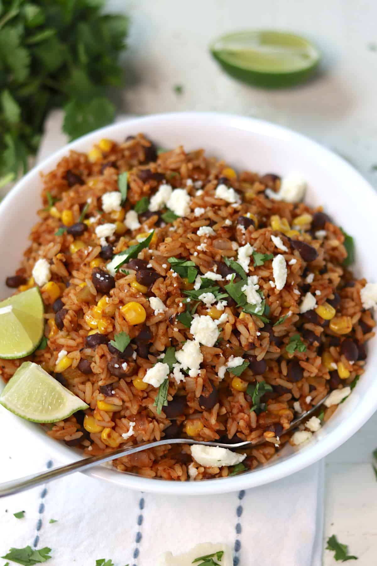 A white bowl of fried rice Mexican-style.