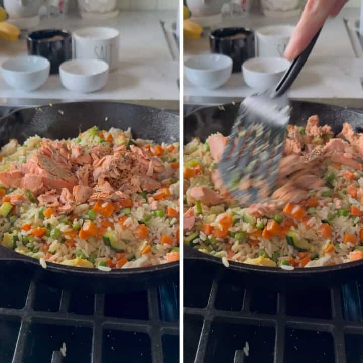 Adding the salmon to the fried rice in a skillet.