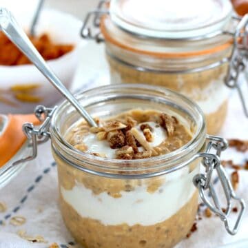 A lidded glass jar of pumpkin overnight oats.