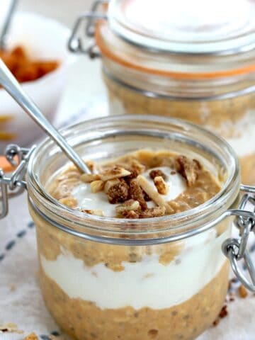A lidded glass jar of pumpkin overnight oats.