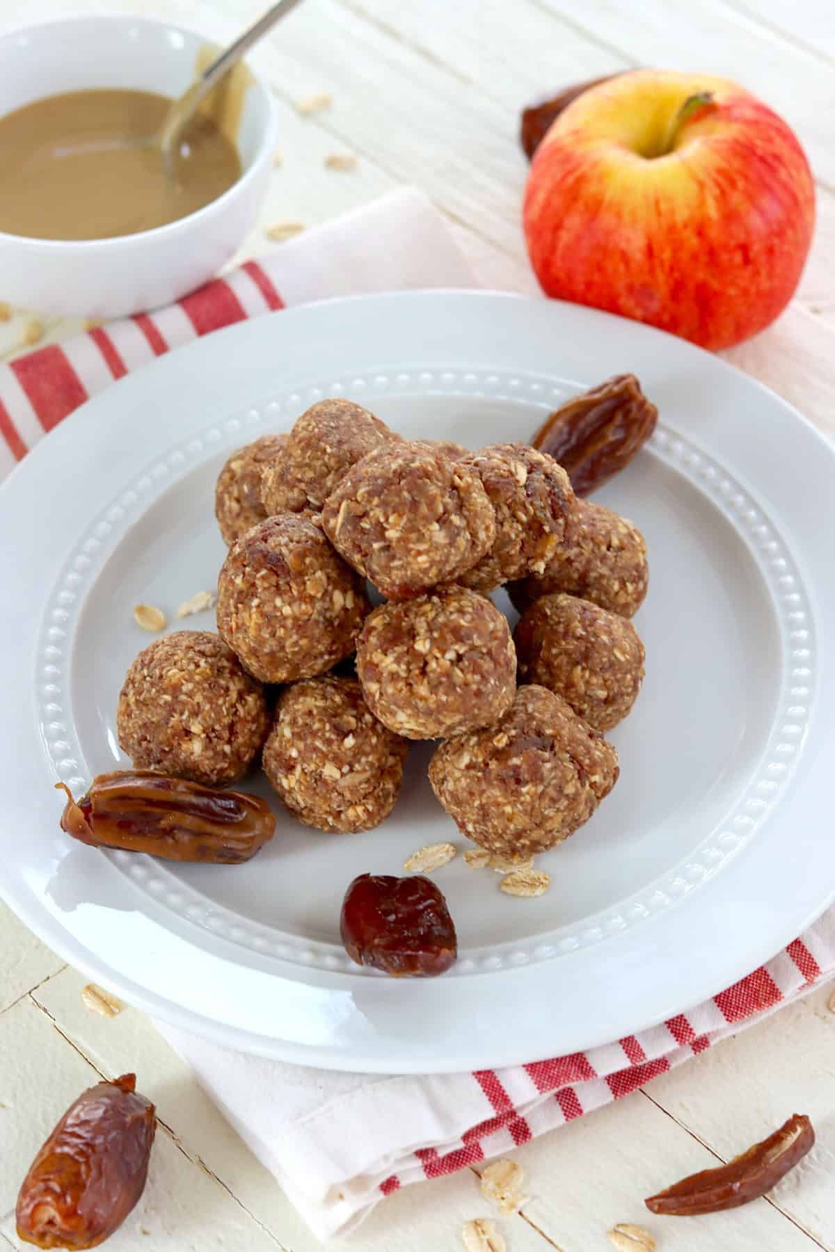 No bake energy bites on a white plate.