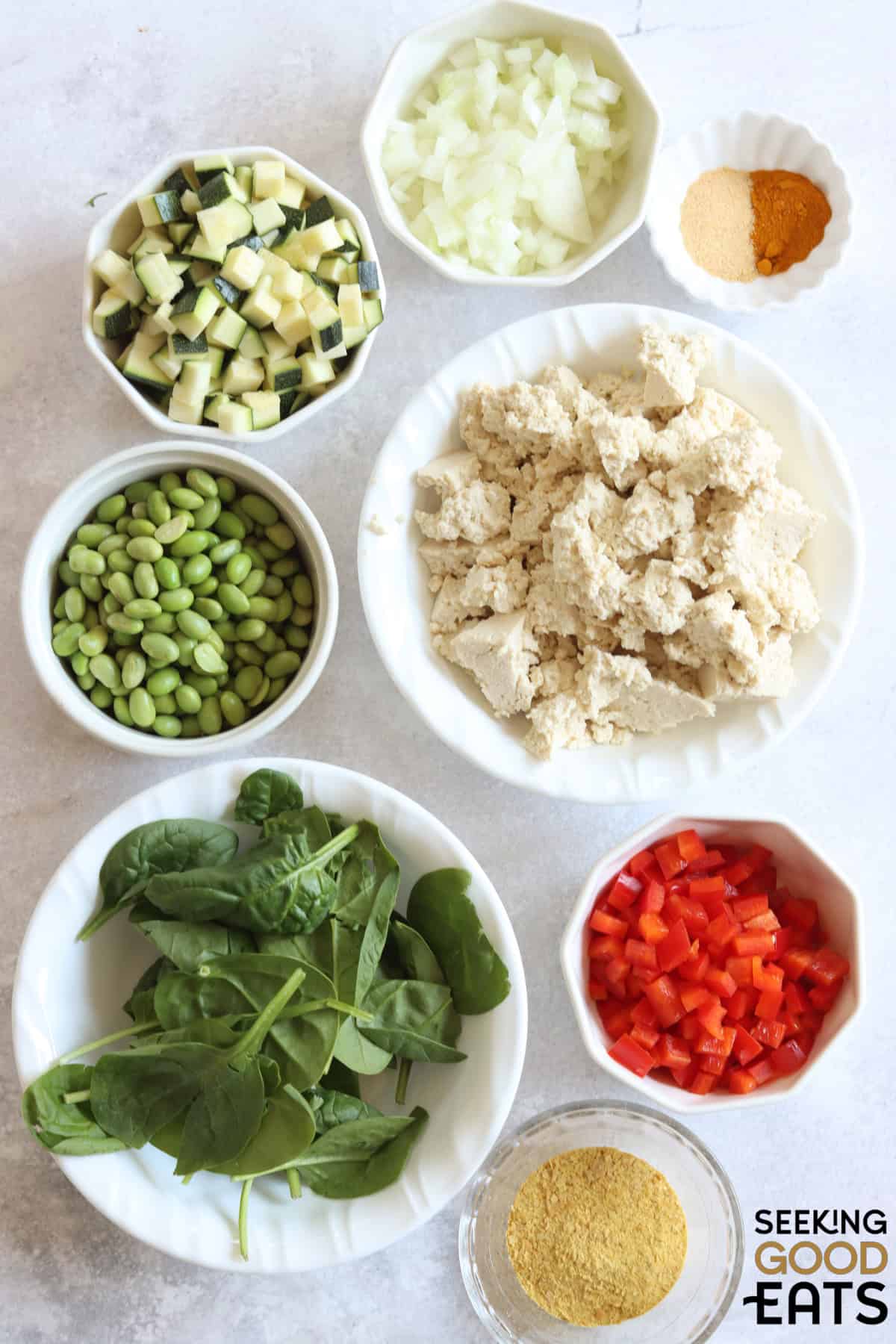Ingredients needed for tofu scramble on a white board.