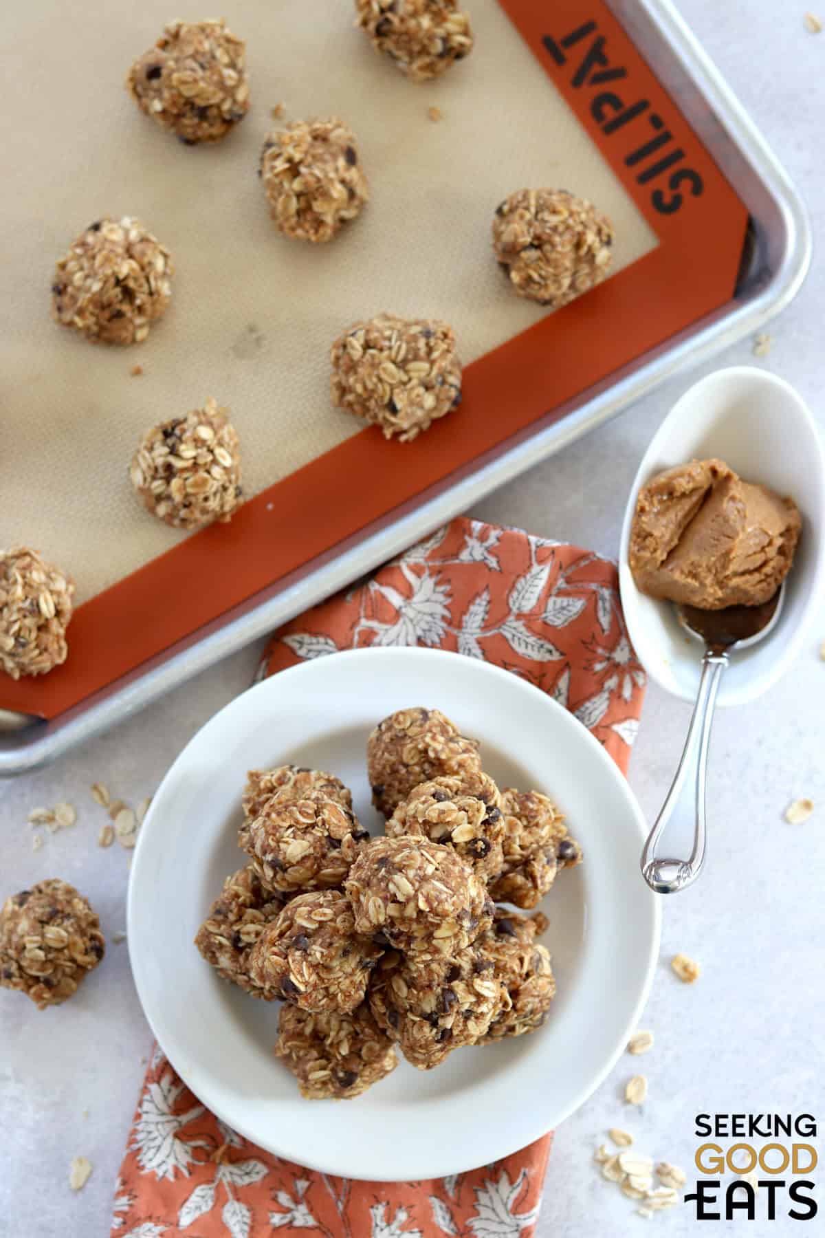 No bake oatmeal and peanut butter balls on a white plate.