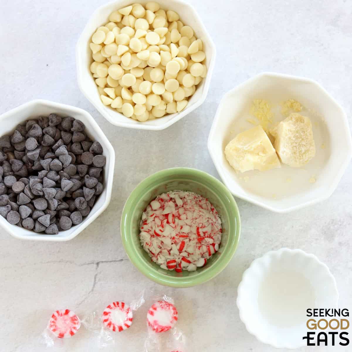 Ingredients needed to make sugar free peppermint bark on a white marble countertop.