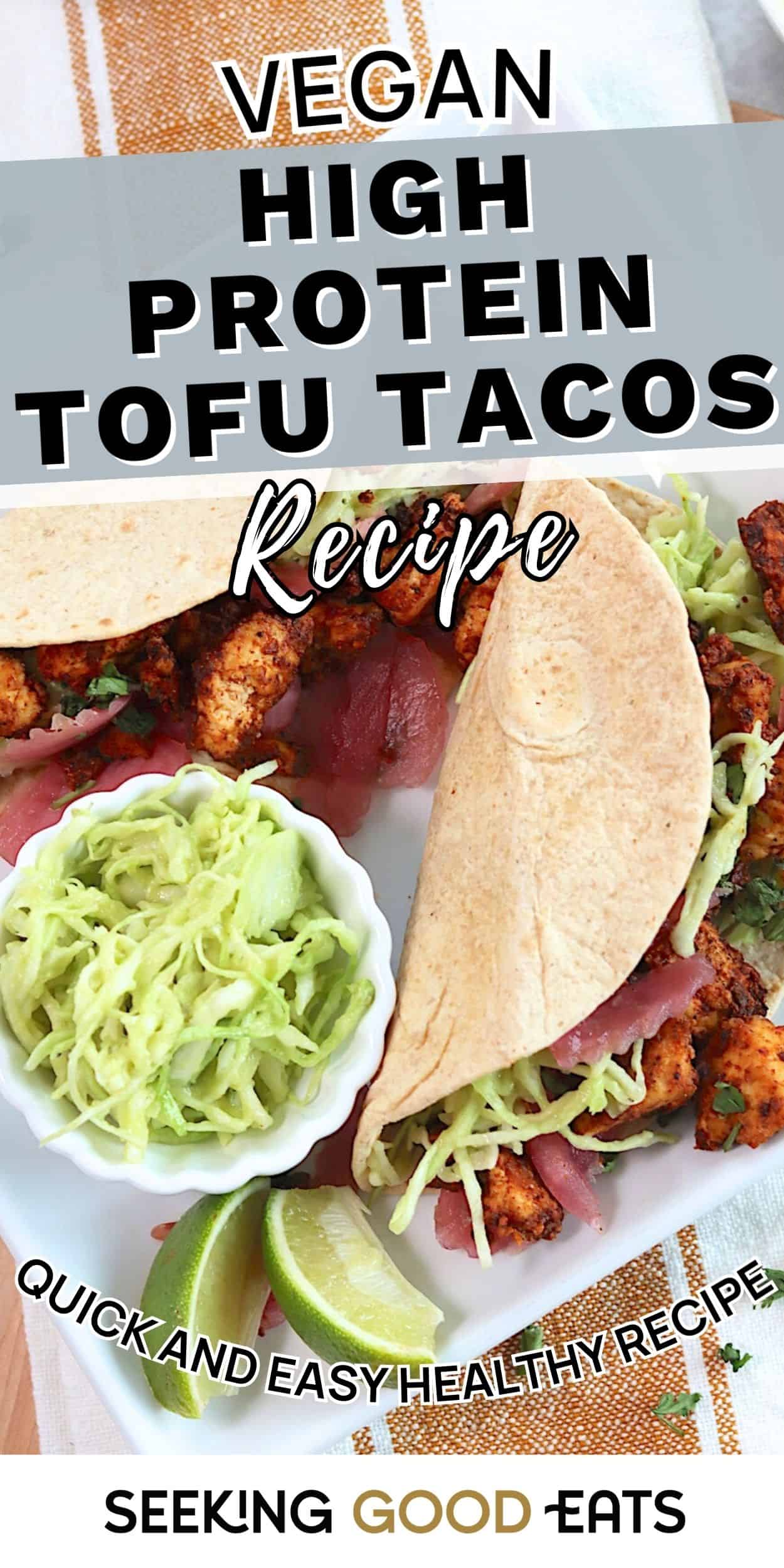 Two vegan tofu tacos filled with seasoned taco tofu crumbles, cabbage slaw, and pickled onions, served with lime wedges. A high protein tofu tacos recipe plated for a quick and easy dinner.