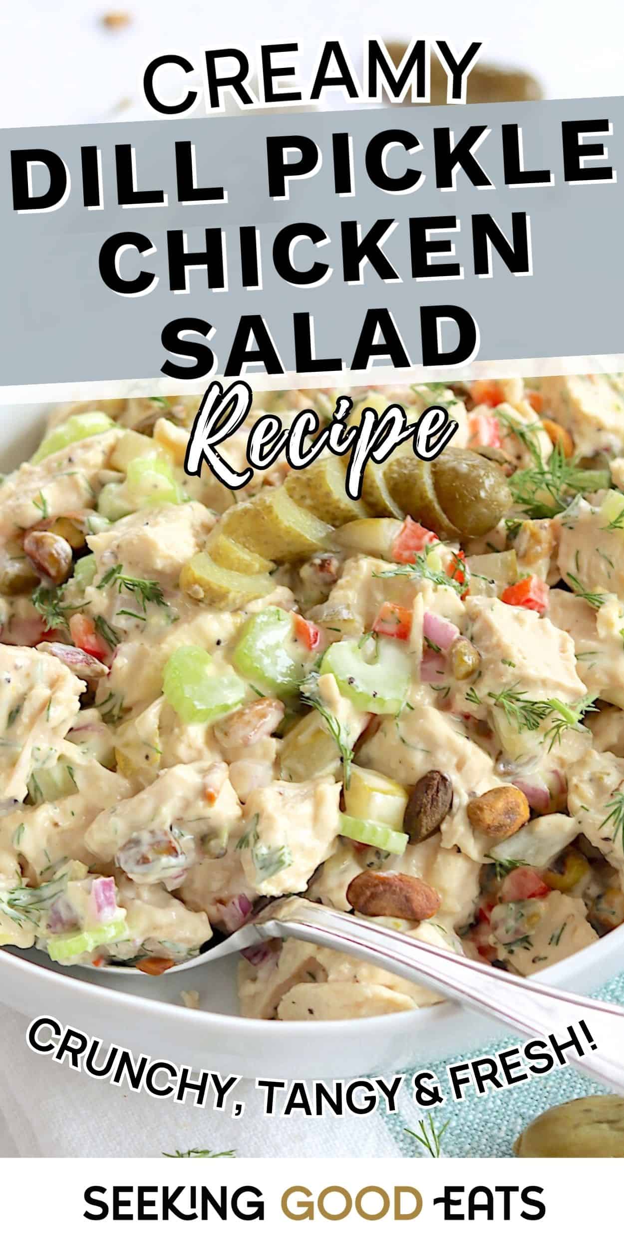 A bowl of creamy dill pickle chicken salad with sliced pickles, celery, herbs, and chunks of chicken. This dill pickle chicken salad is a crunchy, tangy cold chicken salad perfect for sandwiches or cold lunch ideas.
