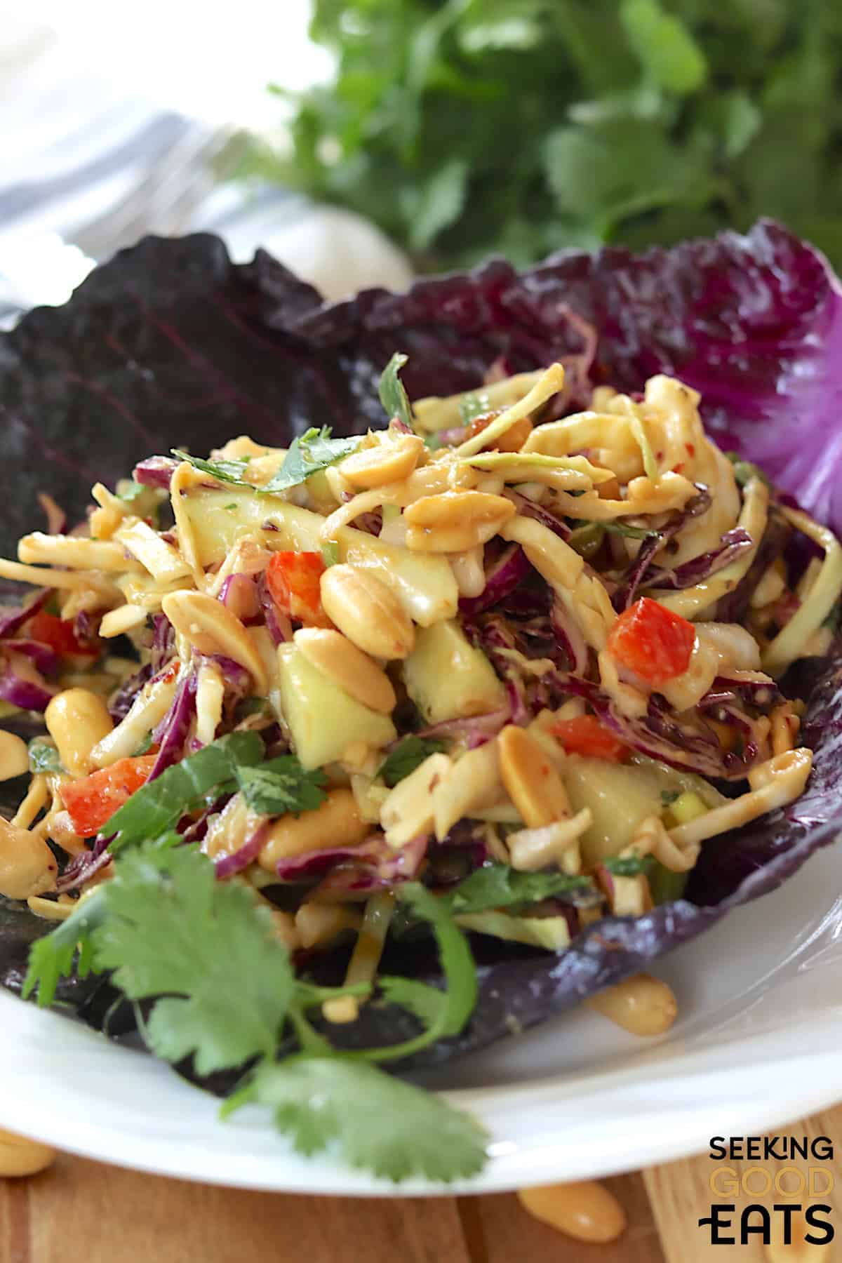 Thai salad served in a red cabbage leaf.