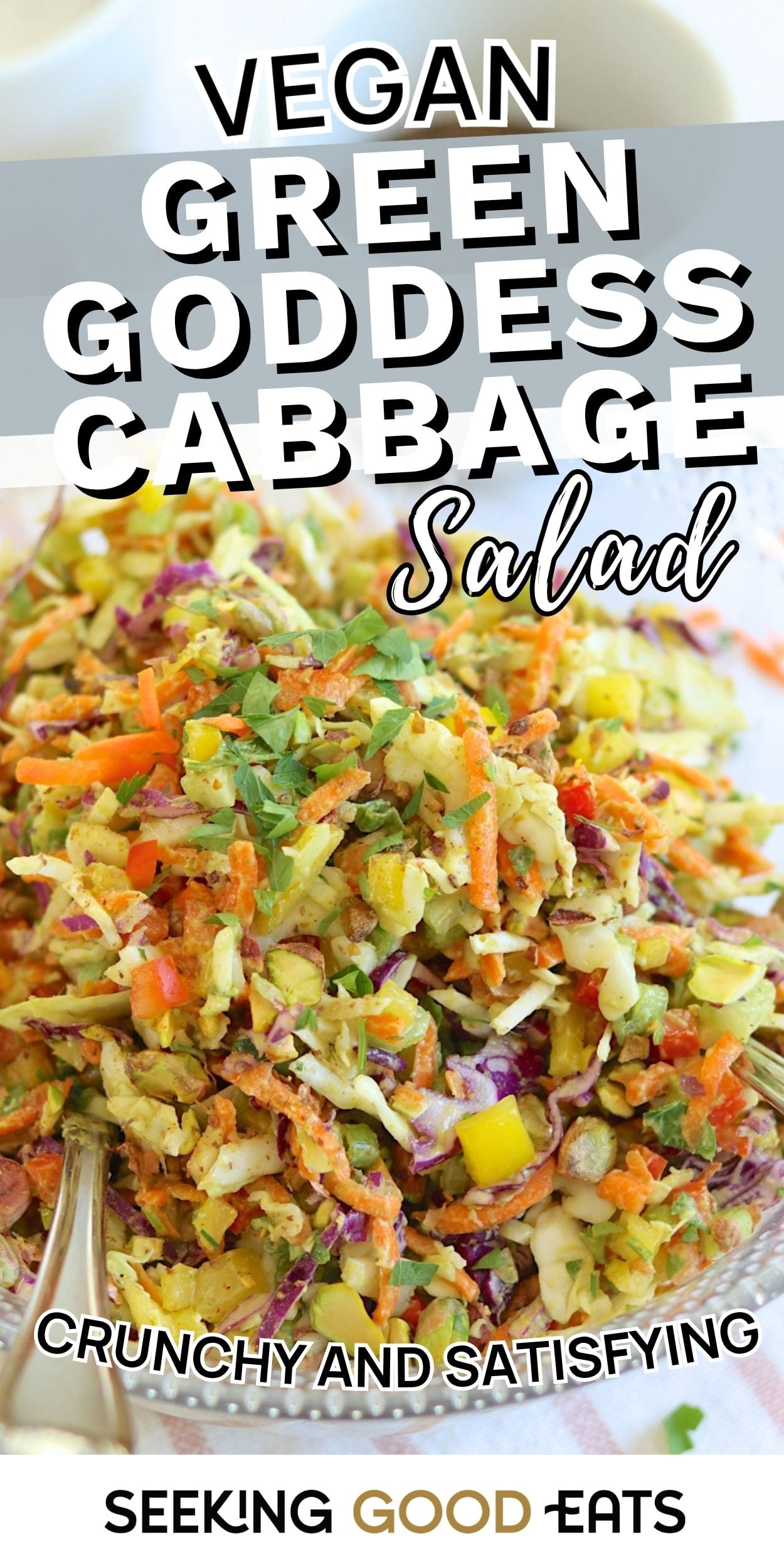 Bowl of green goddess cabbage salad with shredded cabbage, carrots, and herbs. A colorful viral green goddess salad recipe.