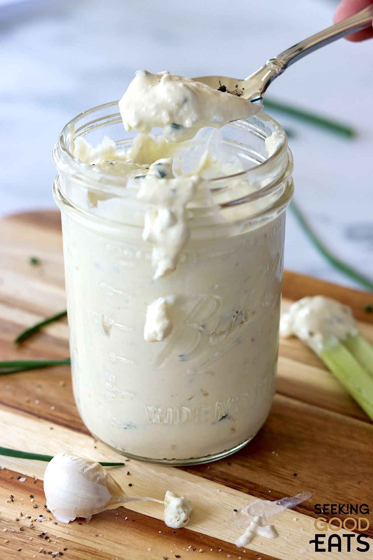 A jar of the best blue cheese dressing with a spoon.