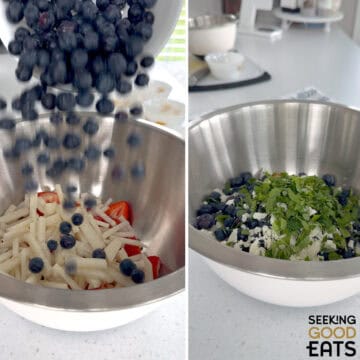 Adding all the fresh ingredients to a silver mixing bowl to make red white and blue fruit salad.