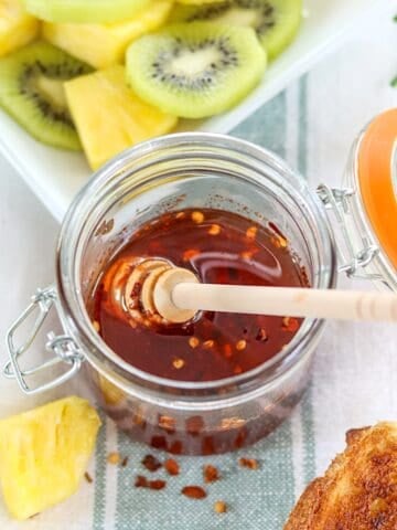 Hot honey in a clear lidded jar.