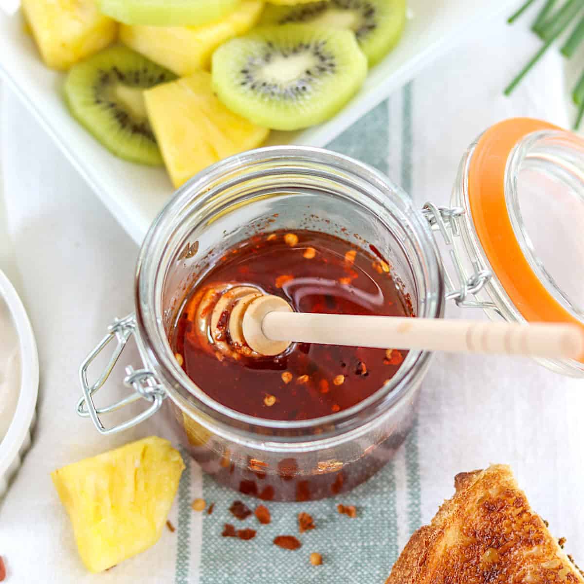 Hot honey in a clear lidded jar.