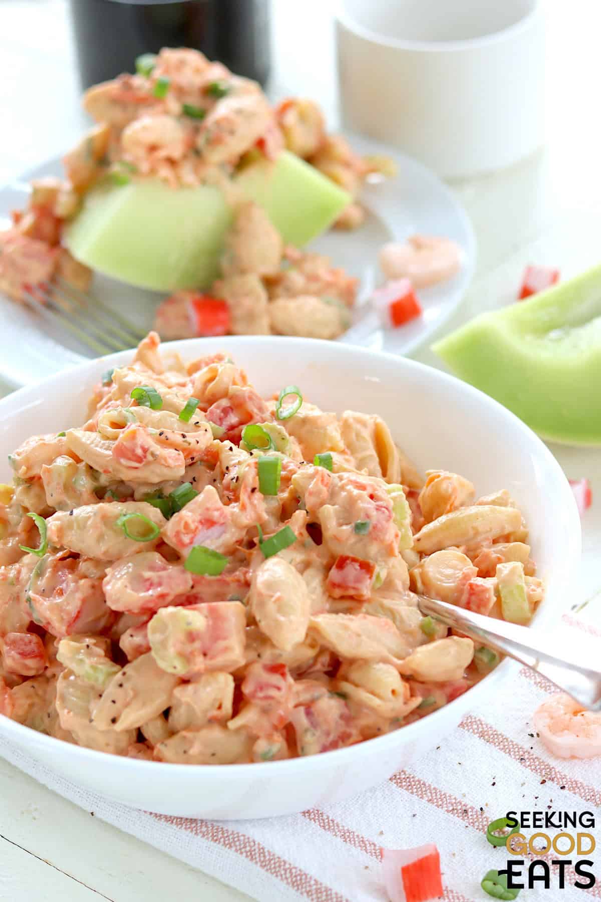 Bowl of creamy seafood pasta salad on the table.